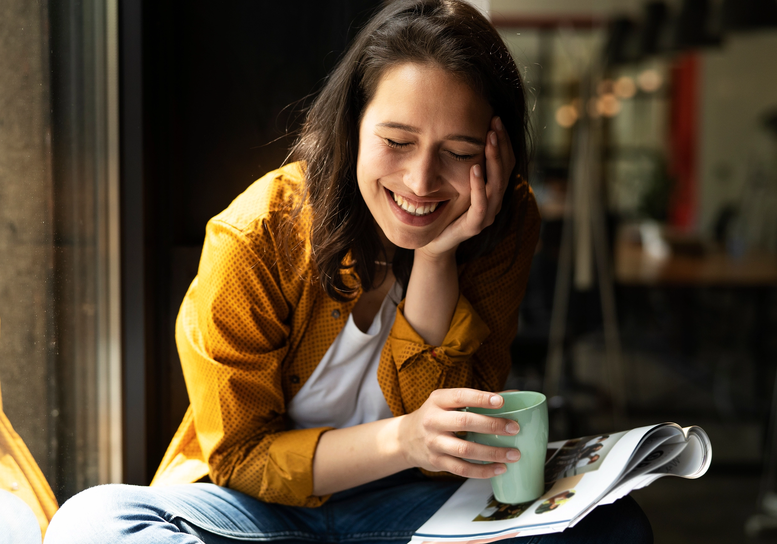 Flexible workplace benefits at nimbus - happy woman with coffee