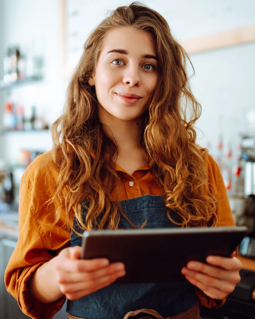 nimbus employee scheduling software - woman at workplace on tablet